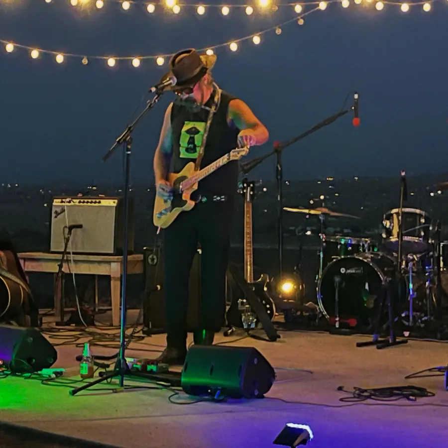 House show on the outdoor stage under string lights